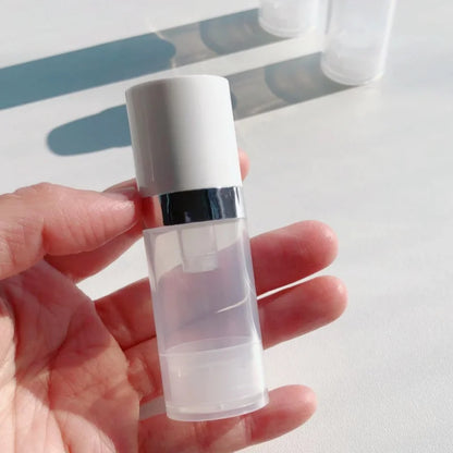 Travel Cosmetic Bottles with Pump - 5Pcs Vacuum Containers for Skincare Products"